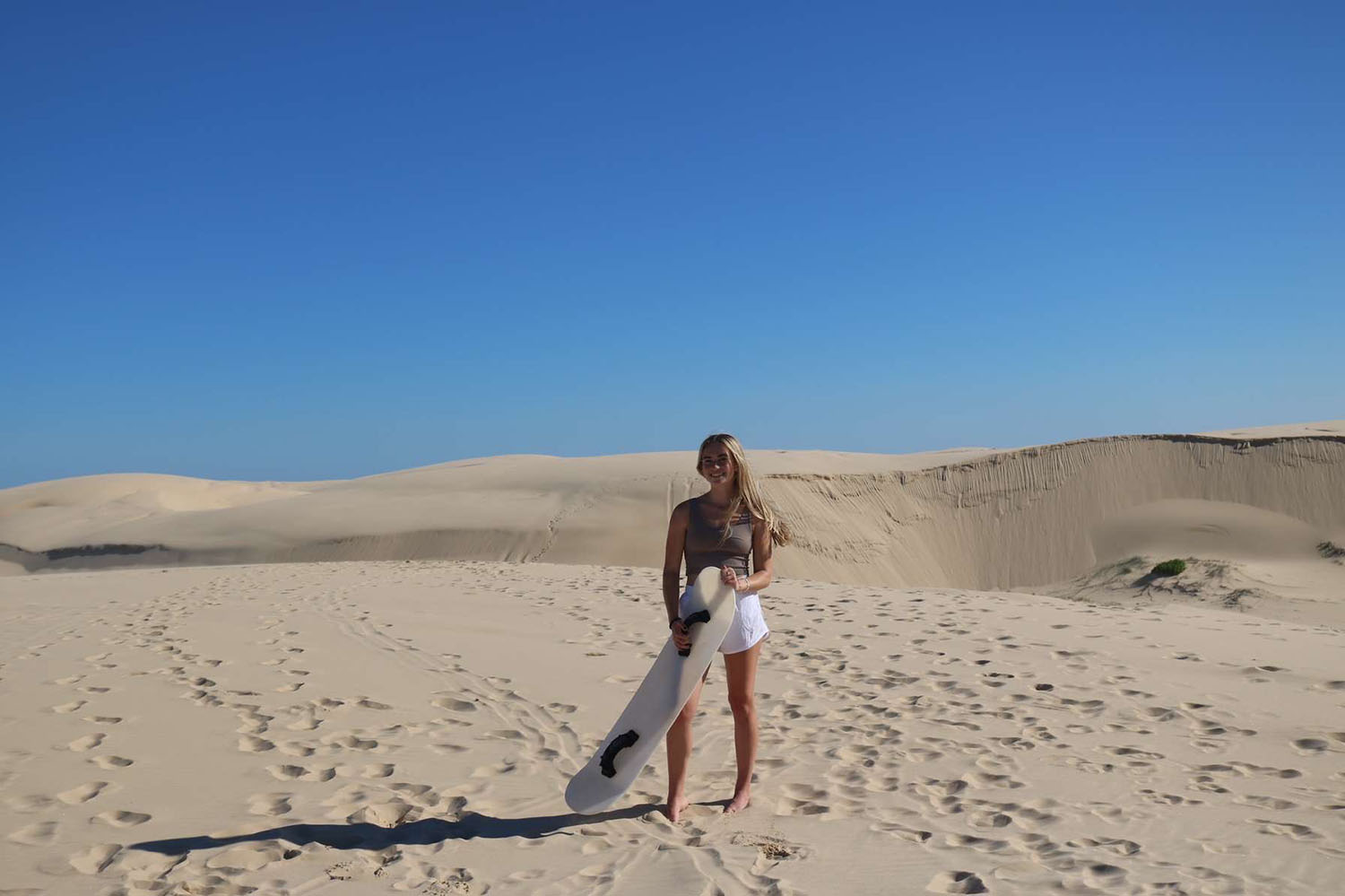 Molly Nemeth ’26 on sand dunes.