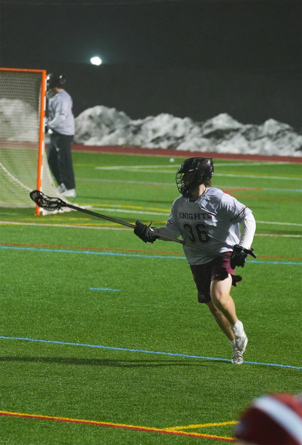 Jacob Mann ’26 playing lacrosse.