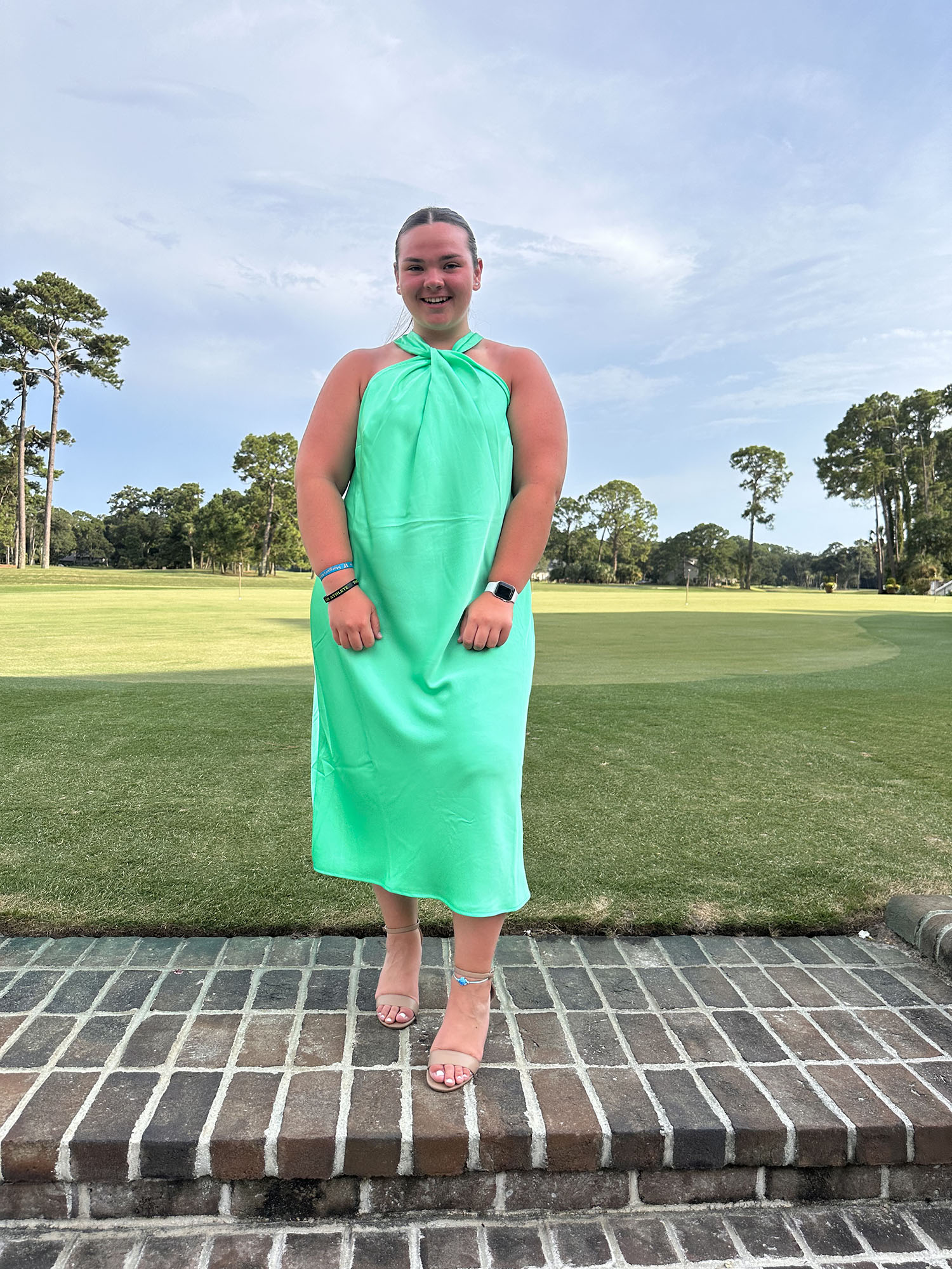 Taylor Migliore ’26 on a golf course.
