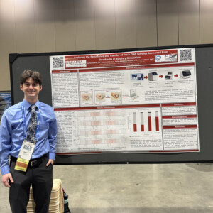 James Seltzer ’26M presenting a poster.