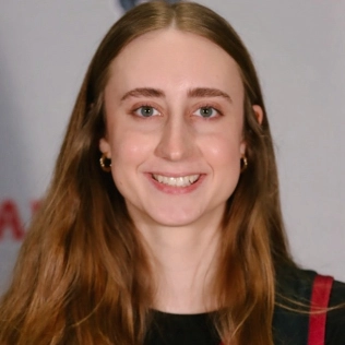 Honors Convocation 2025 award recipient Emily M. Schall smiles in her headshot.
