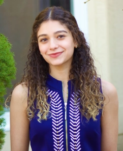 Honors Convocation 2025 award recipient Victoria H. Fallouh smiles in her headshot while outdoors.