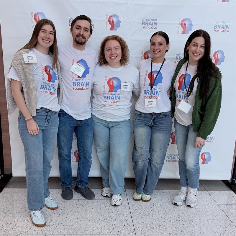 Arcadia student volunteers at the Mind Your Brain @ Penn Medicine conference with Prof. Sophie Farley