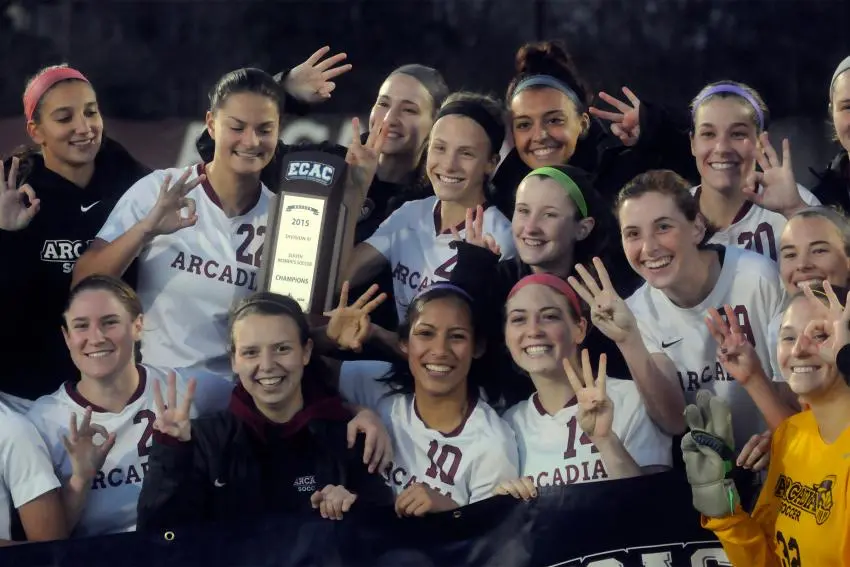 Women's Soccer team holds up the 2015 ECAC trophy