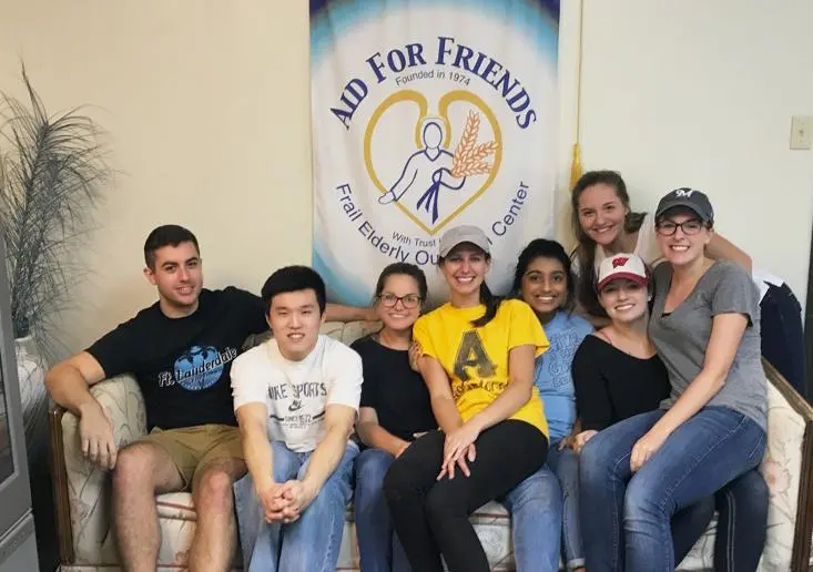 Physician assistant students volunteering at an organization for frail elderly people.