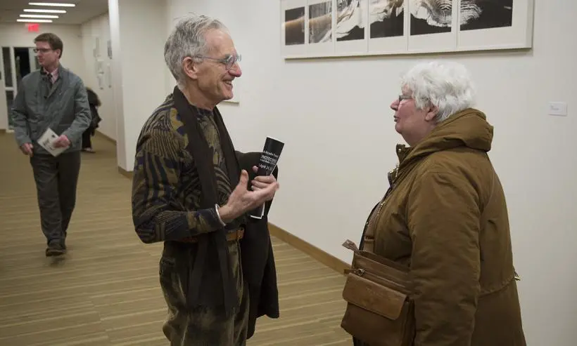 Visitors discussing Pati Hill's work.