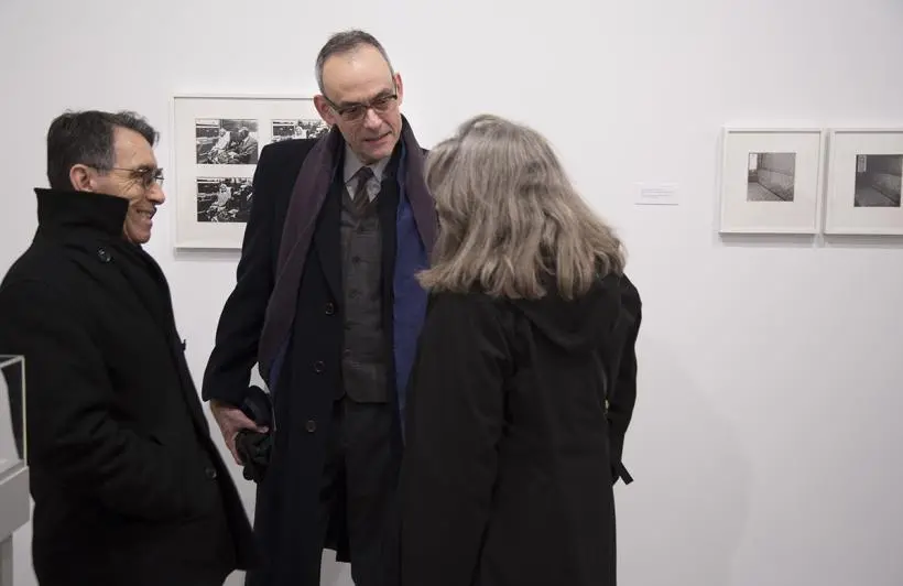 Visitors discussing Pati Hill Photocopier pieces.