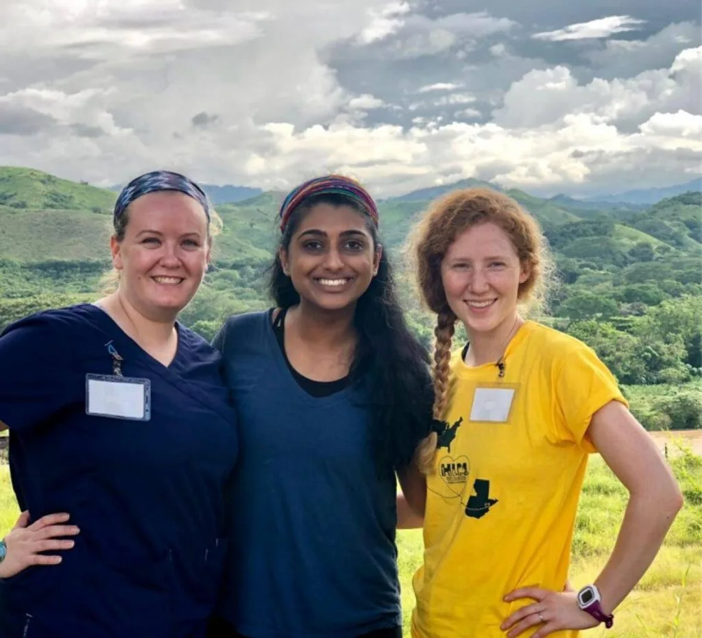 Katherine Arnao, Raveena Saini, and Emily Hunsinger smiling in Guatemala.