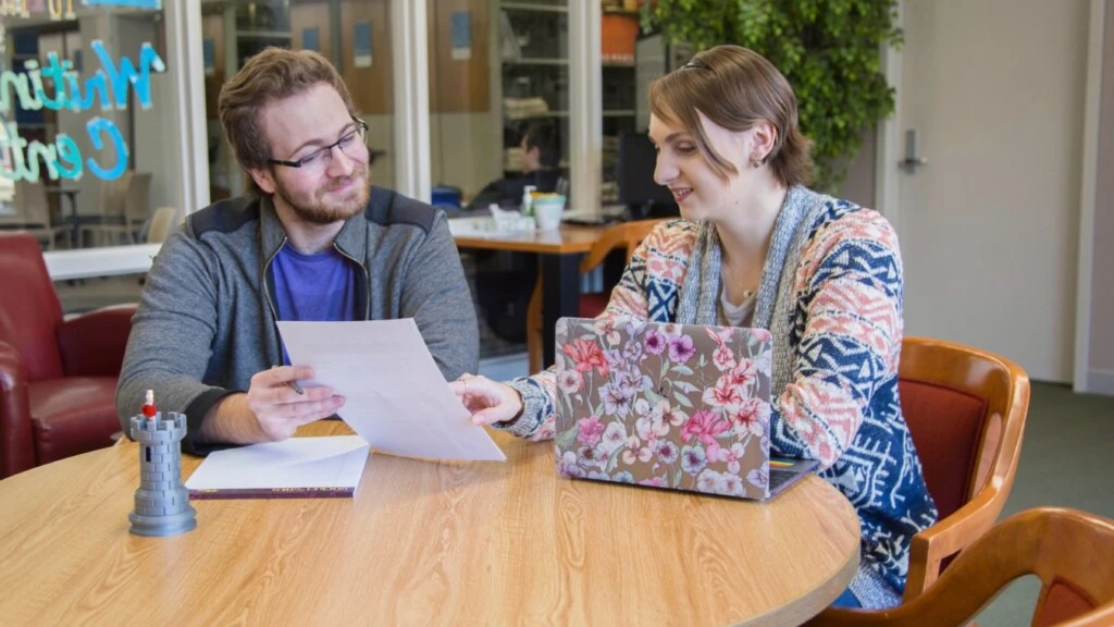 Man and Woman reading paper