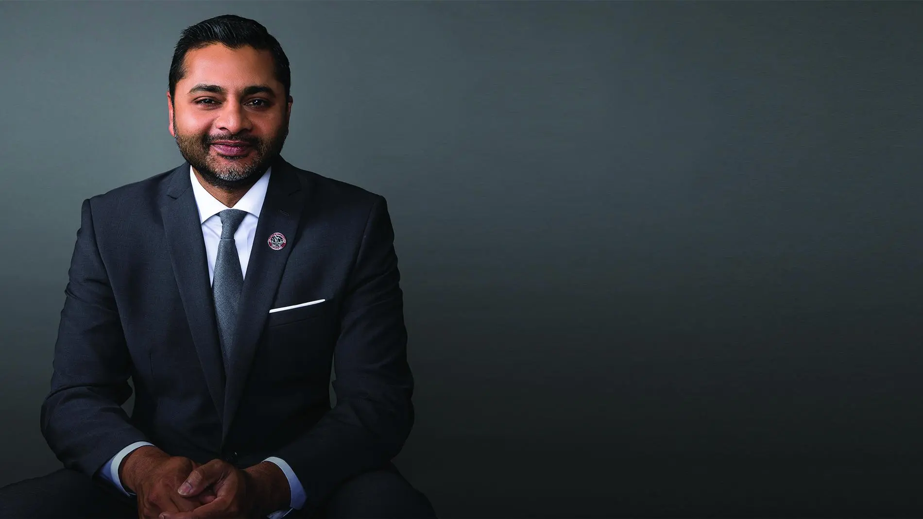 President Ajay Nair, Ph.D. smiling at the camera.