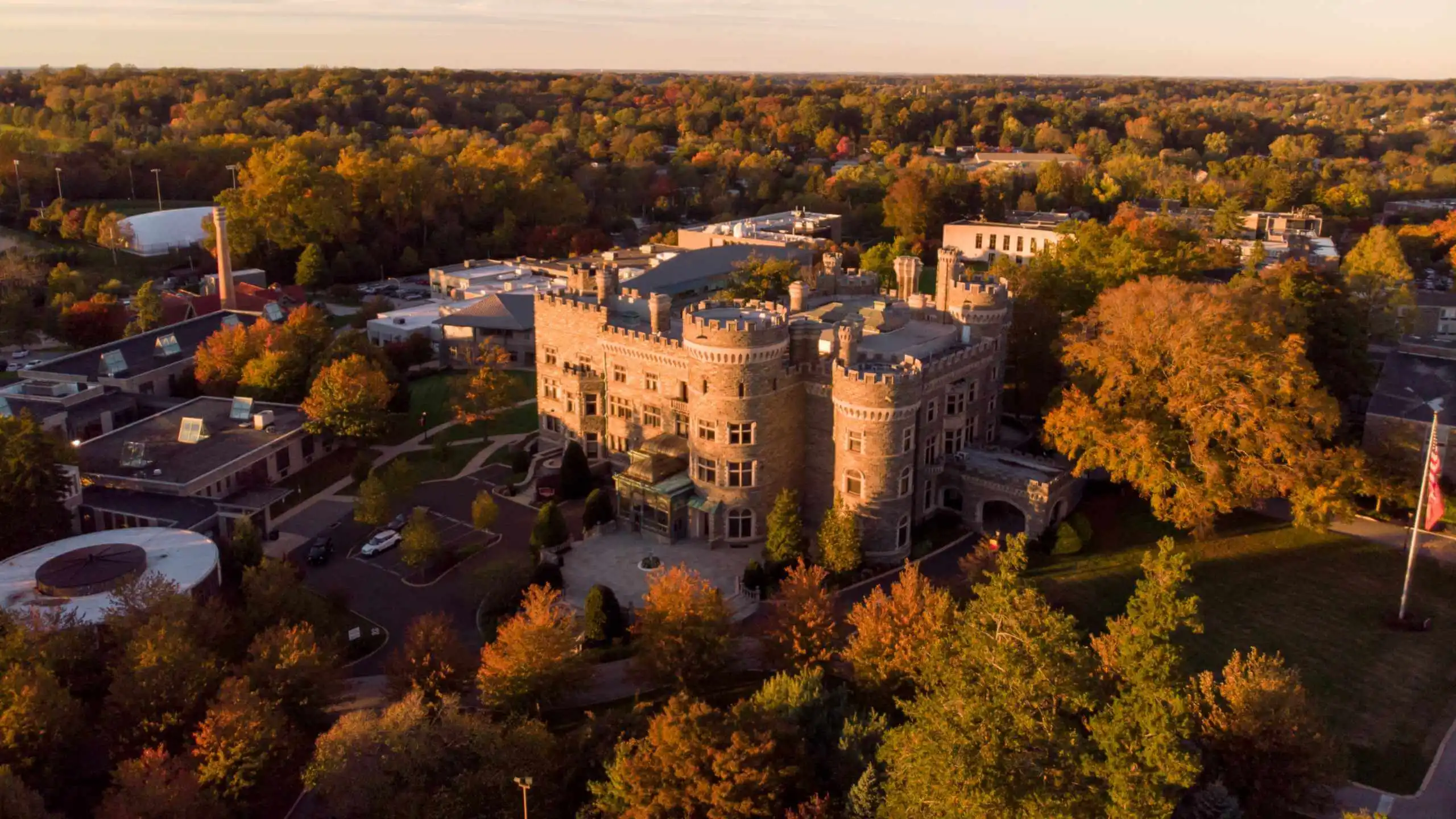 Aerial view of Grey Towers in golden evening sunlight