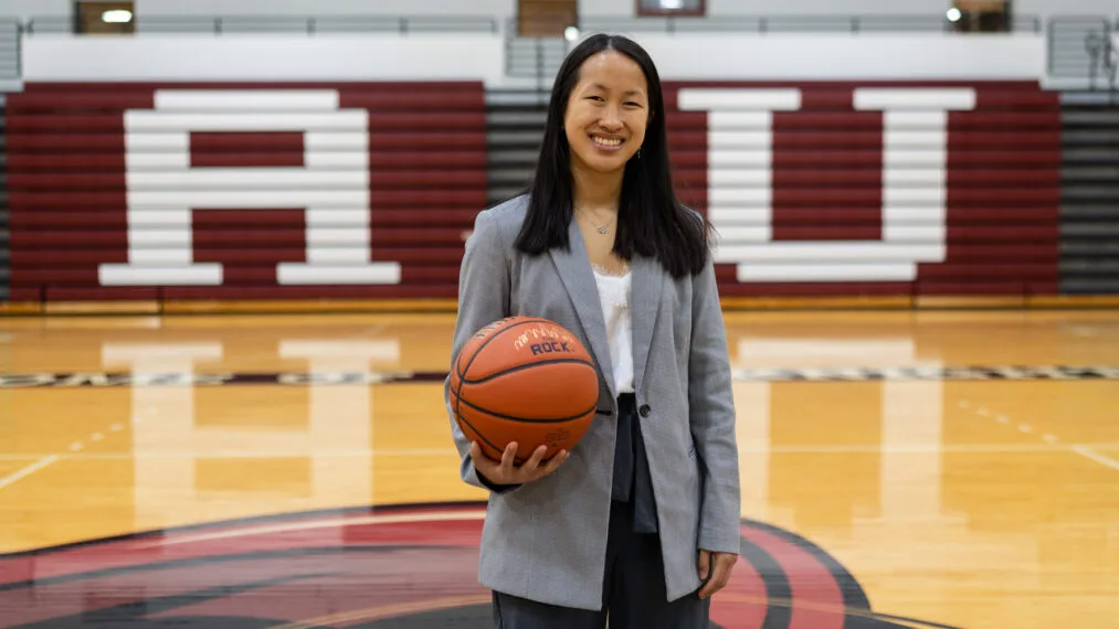 Scarlett Glasser-Nehls headshot on basketball court.