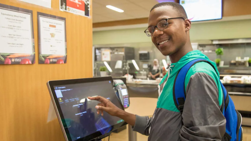 A student uses a computer at Dining Services.