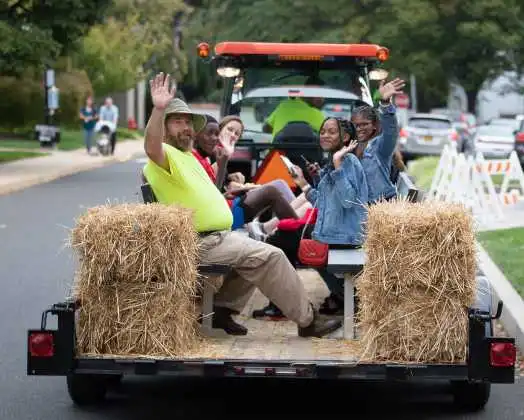 Students enjoy a hayride around campus at Homecoming