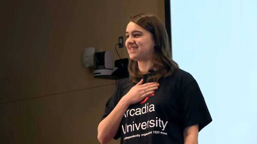 An honors student presents during a TEDx talk.