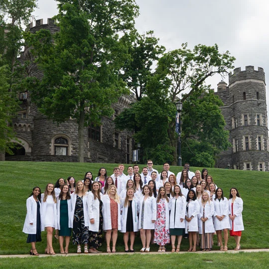 PA white coat students in front of the Grey Towers Castle.