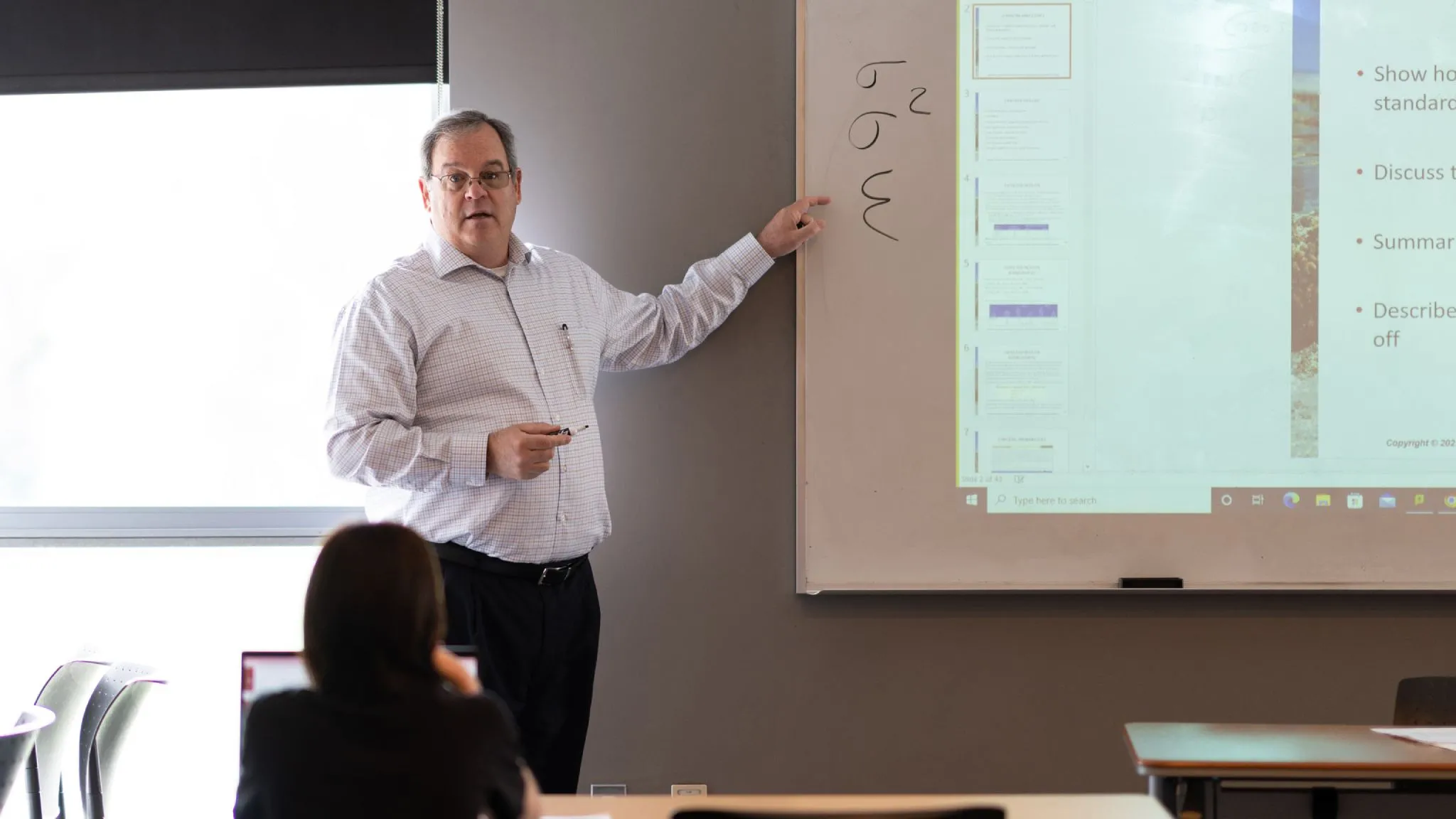 A professor teaches a business class.