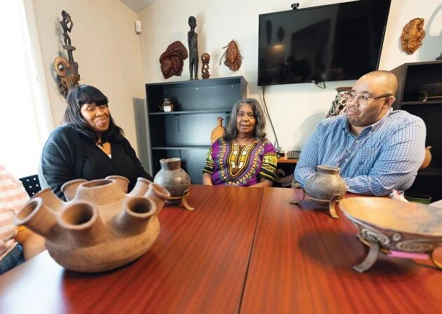 CASAA leaders meet around table with students