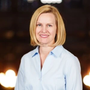 Woman in business causal outfit blurred background headshot