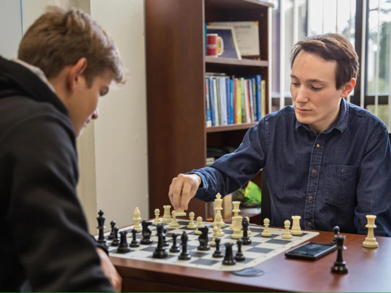 A game of chess played by Vitaly Ford and a student in the Landman Library.