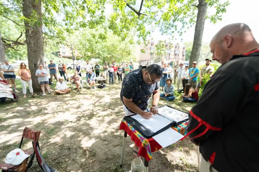 Dr. Martin signs the treaty of renewed friendship with the Lenape Nation of Pennsylvania in outdoor ceremony