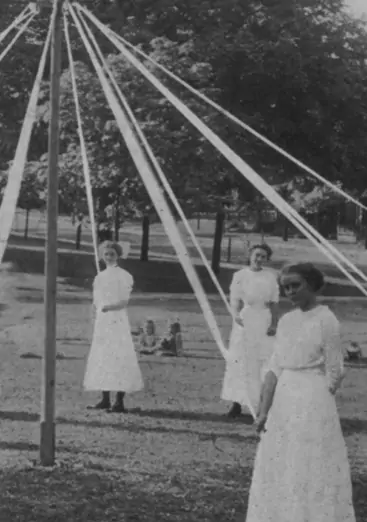 Girls holding ribbon for the maypole