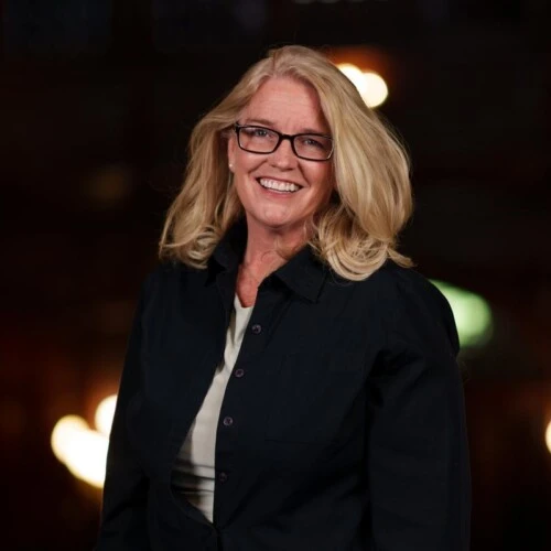 Dr. Kimberly Dean in a professional photo wearing a black coat