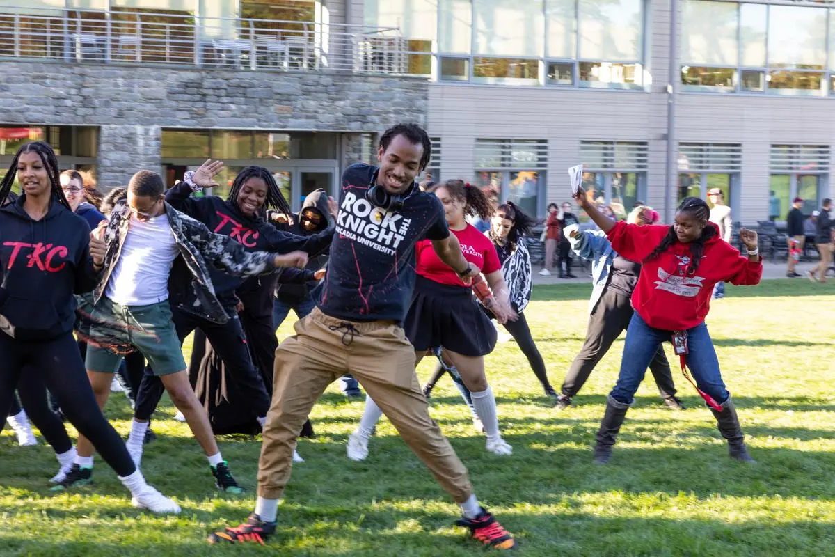 Students dance during homecoming & family weekend