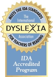 A blue-gray and gold logo for the International Dyslexia Association