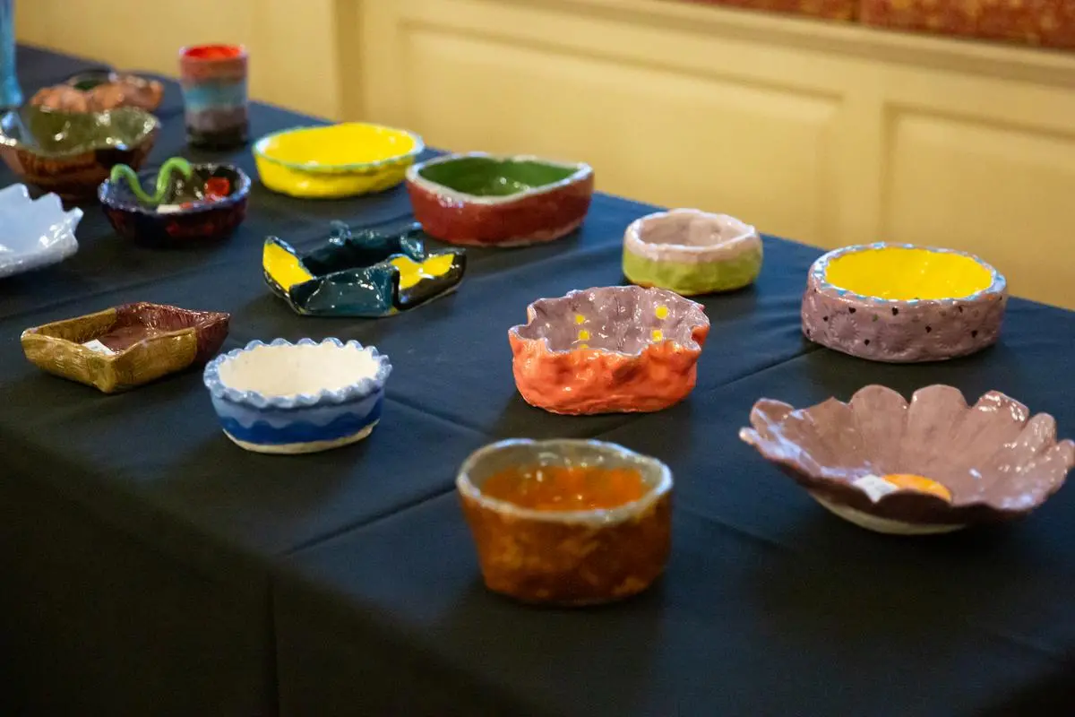 Ceramic bowls on a table that attendees get to select. 