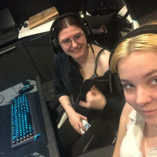 Two students taking a selfie in the Esports Arena