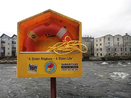a photo of a buoy holder with a sign that reads 