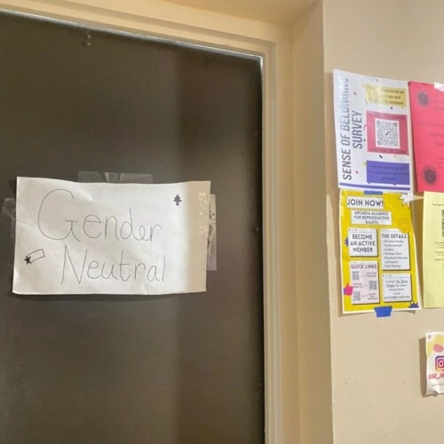 A photo showing a dorm bathroom door showing a sign saying "Gender Neutral"