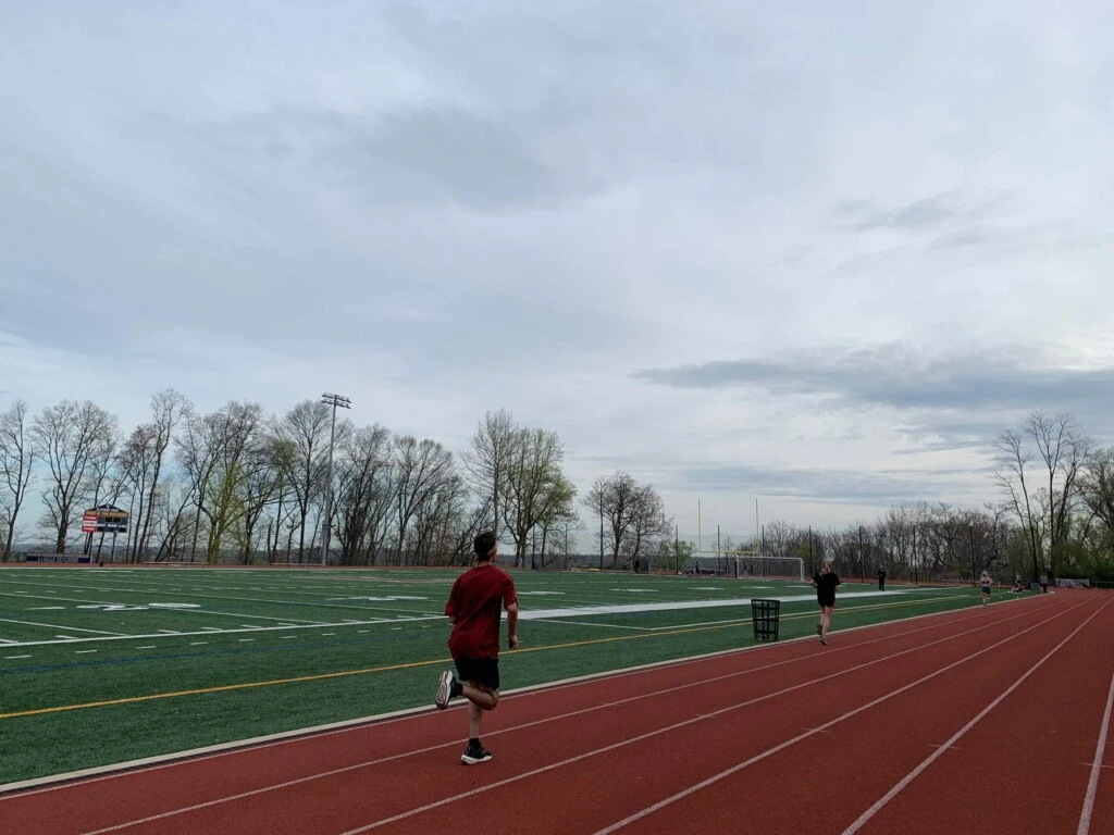 A lone runner on the Arcadia University outdoor track