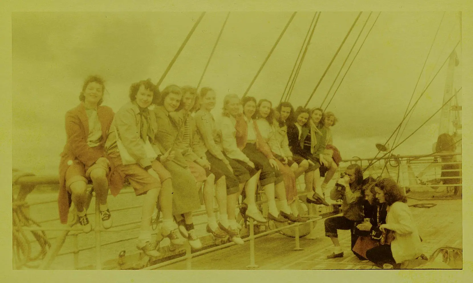 European field trip in 1948, where girls posing together on the shipboard.