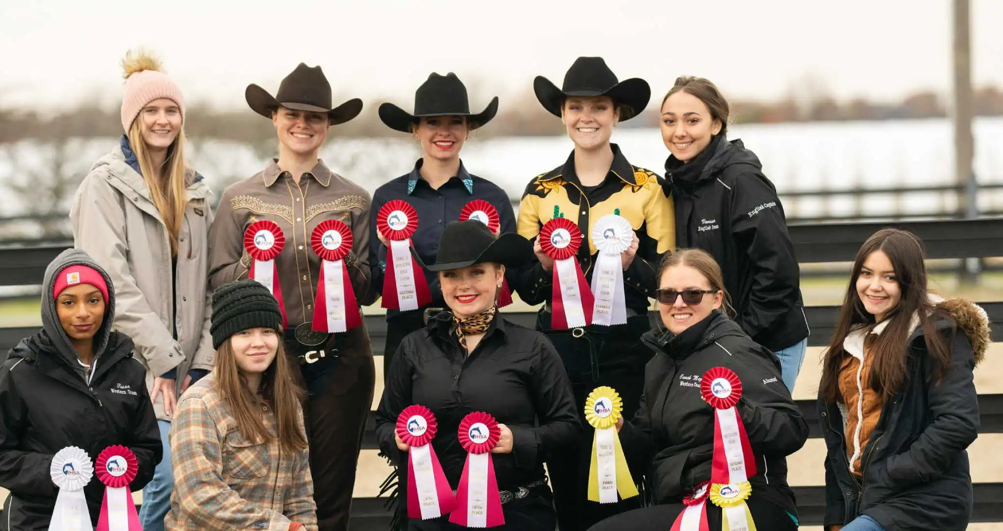 Arcadia's Equestrian Team posing with their award ribbons.