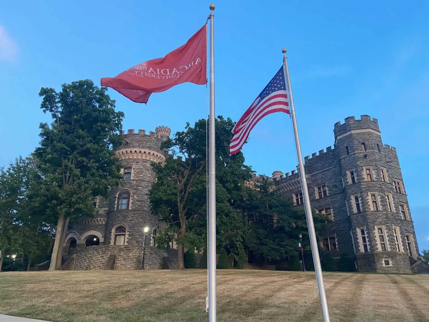 The U.S. flag and the Arcadia flag in front of Grey Towers Castle.