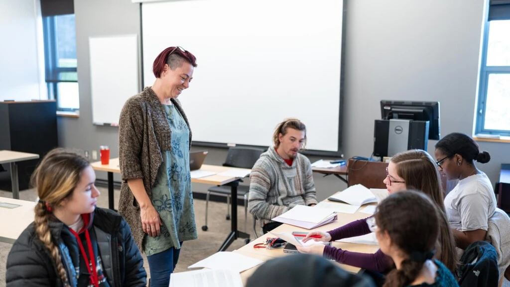 Dr. Amy Widestrom stands as she teaches an undergraduate class covering political science.