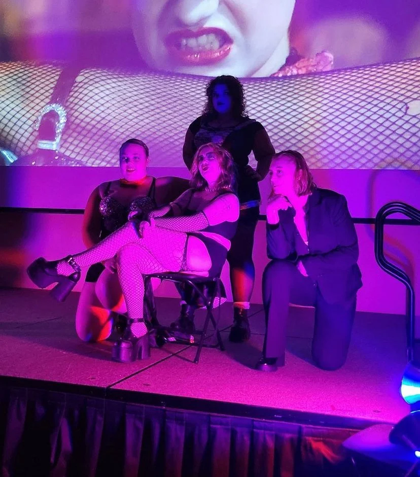 Rocky Horror cast members on stage.