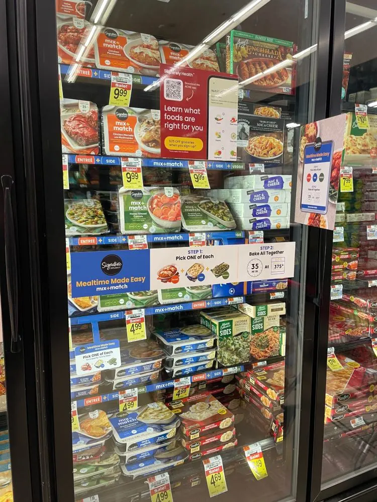Some frozen meals in the freezers at Walmart.