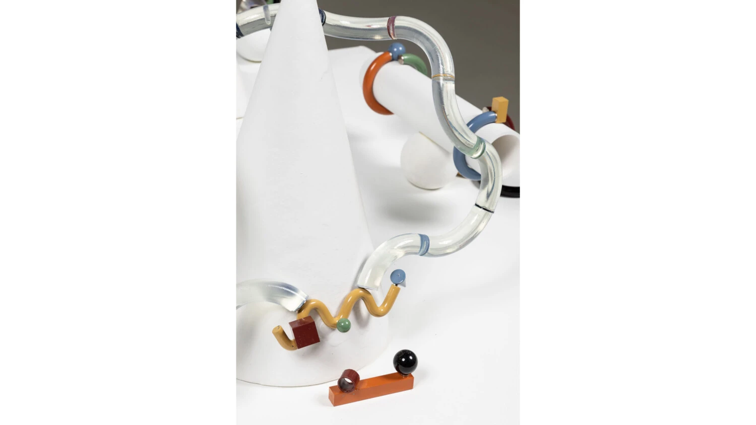 A modern sculpture of a white cone, tubes, squiggles, and other shapes by Ryan Connor '22.