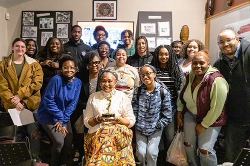 A group poses for Black History Month with Black Philadelphia Mini Lessons, CASAA, Emmy, and Guest Speaker Bernyce Mills DeVaughn.
