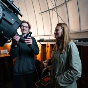 Paul and Tatjana working with a telescope.