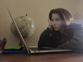 Sarah looking at her computer.