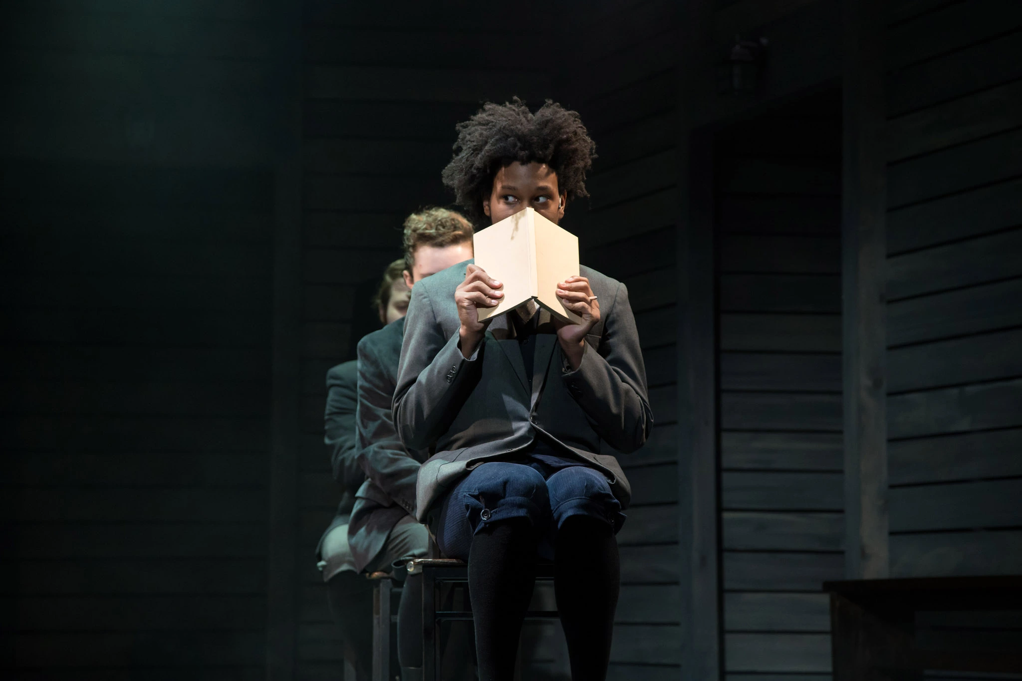 Three actors on stage for the Spring Awakening play.