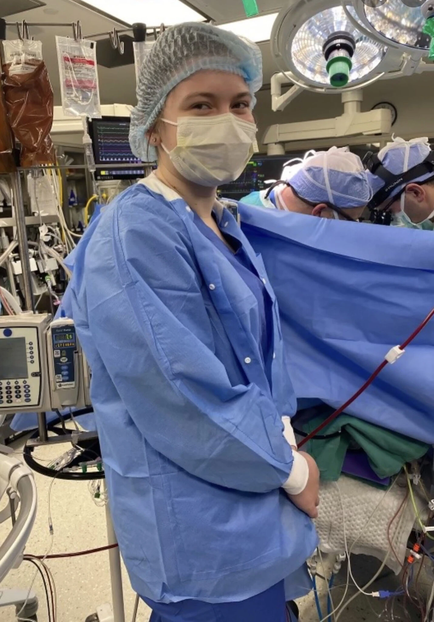 Amellia shadowing a group of surgeons in the operating room.