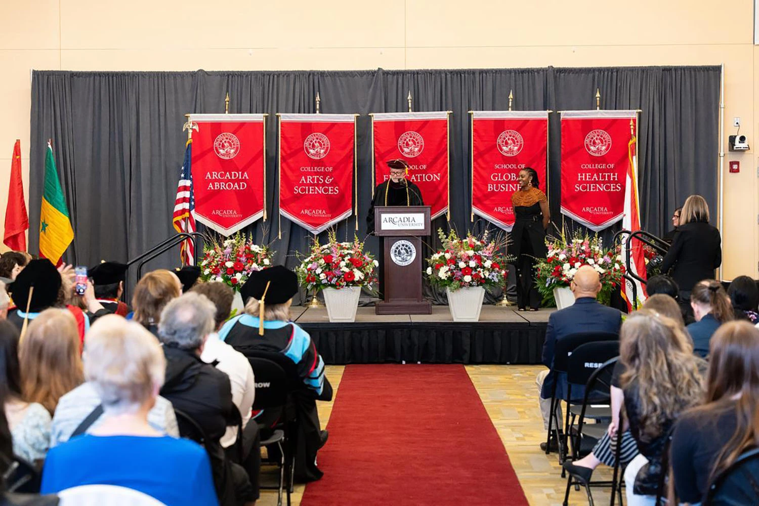 Adjunct Professor Lisa Browne ’20MEd on stage to accept the Adjunct Faculty Award.