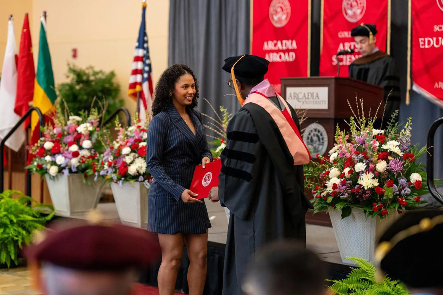 Maria Bernardo ’25 accepting her award from Dean Otieno.