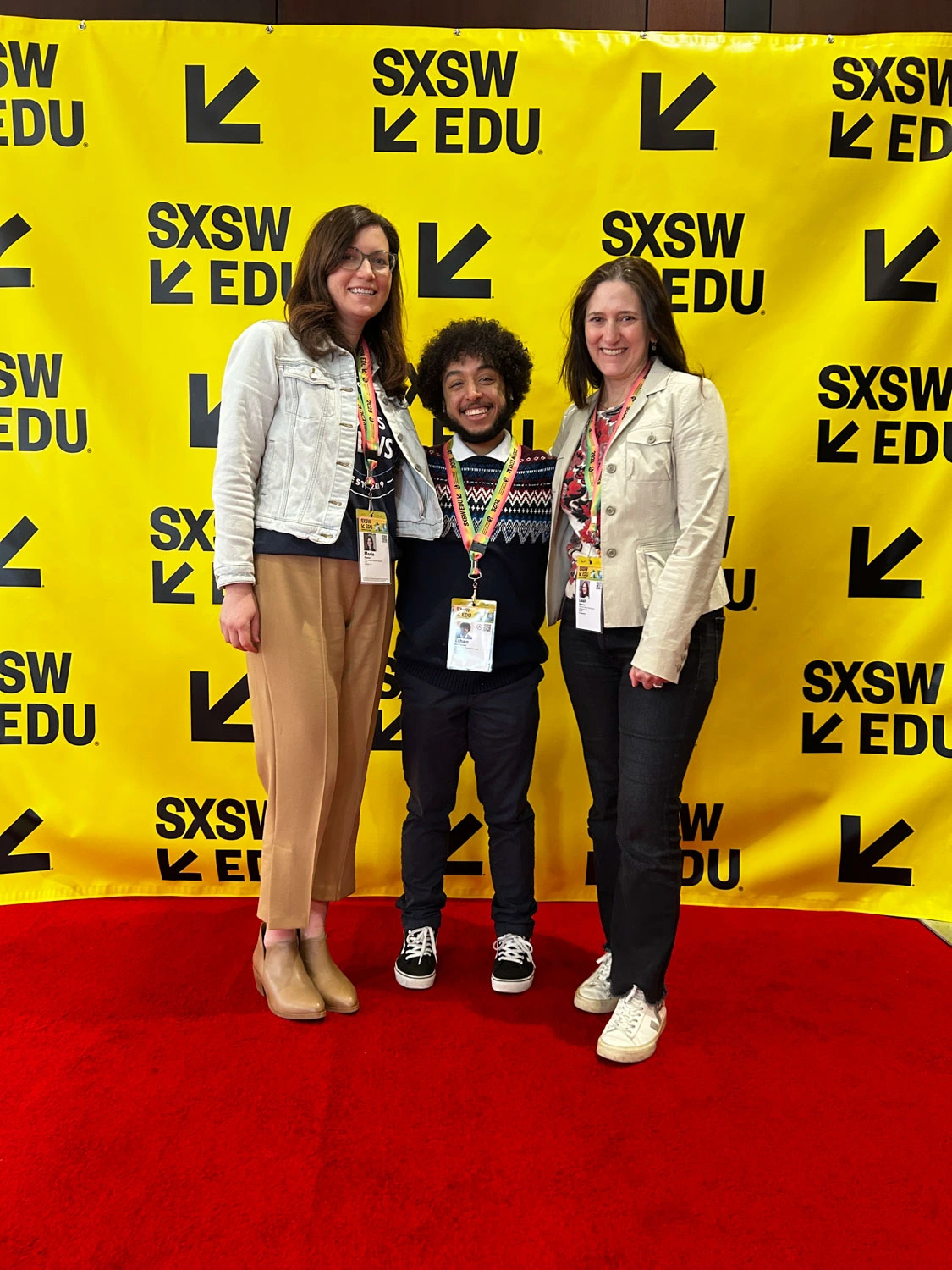 Ethan Rodriguez ’25 standing with two others.