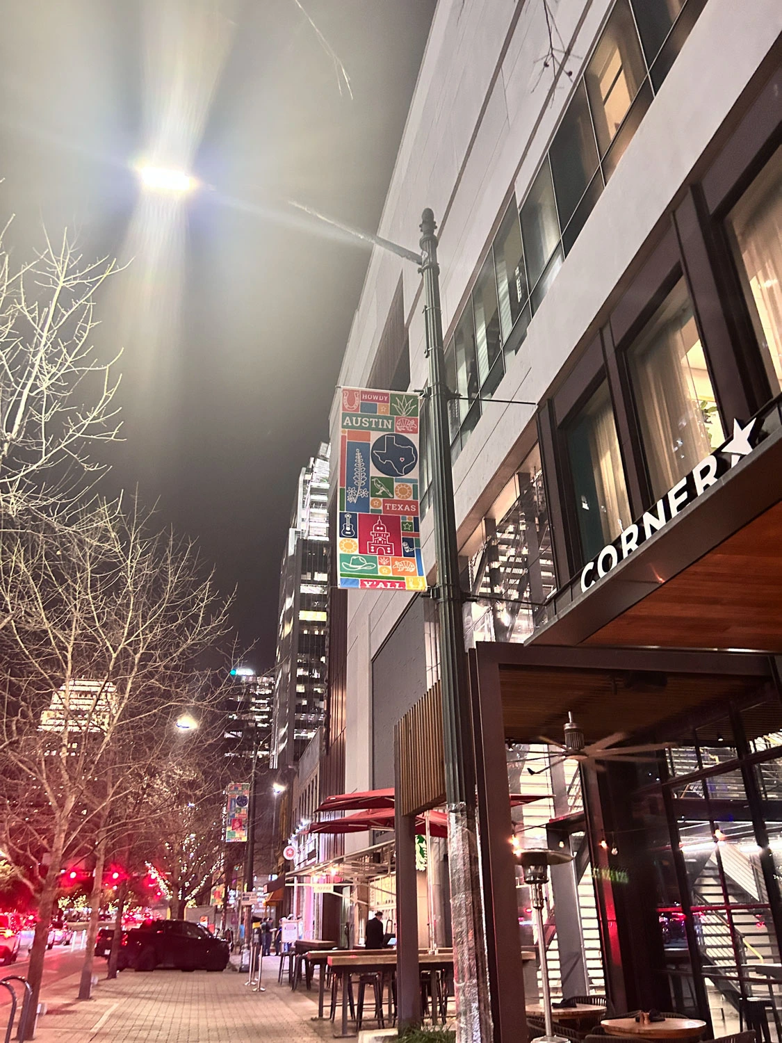 A lamp post with a poster that reads "Austin".